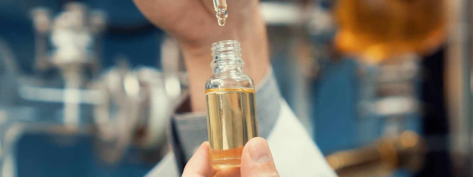 A scientist extracts CBD hemp oil for medicinal purposes in a laboratory.